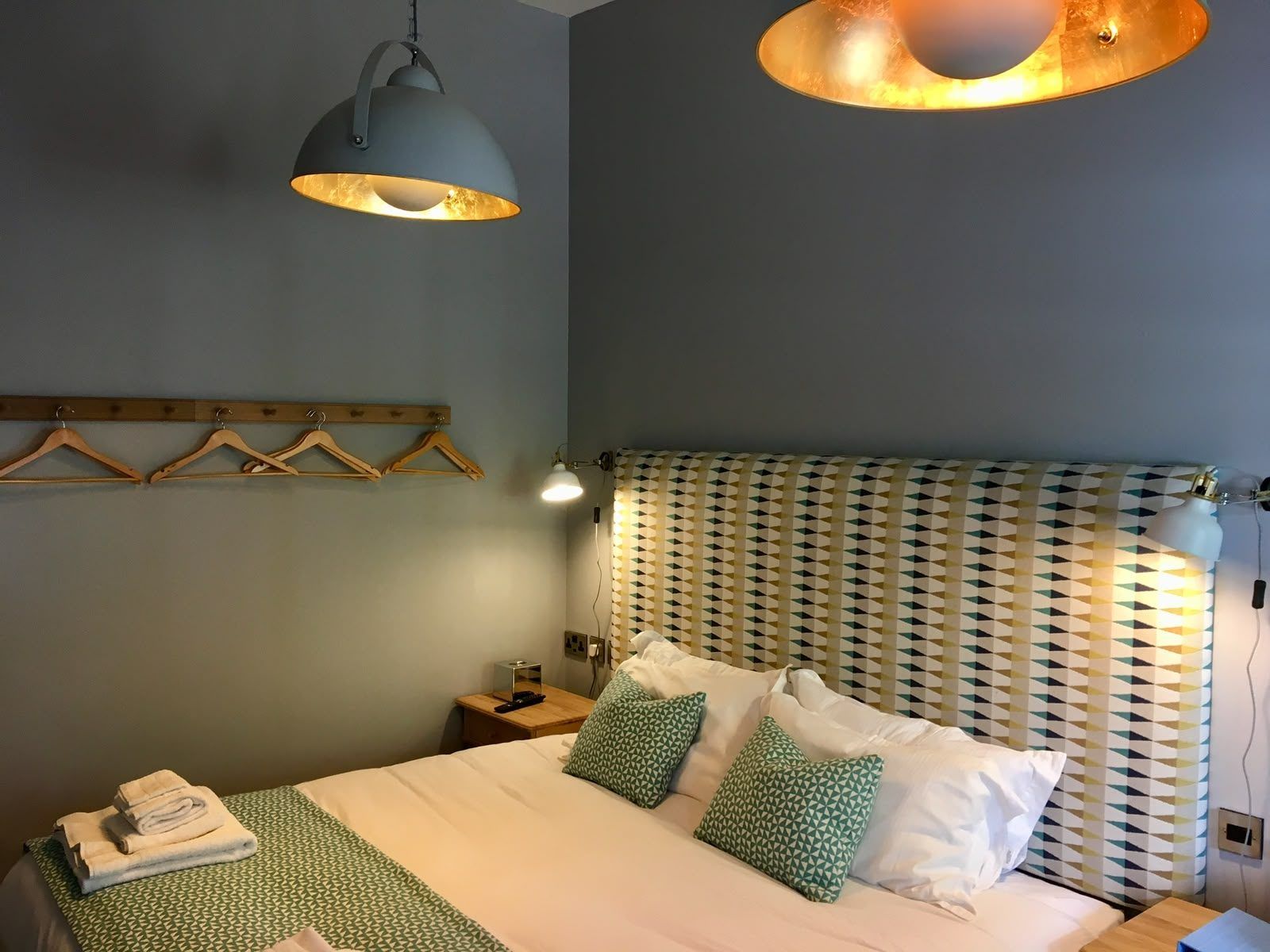 Two bespoke headboards fitted in a coastal twin bedroom, in situ